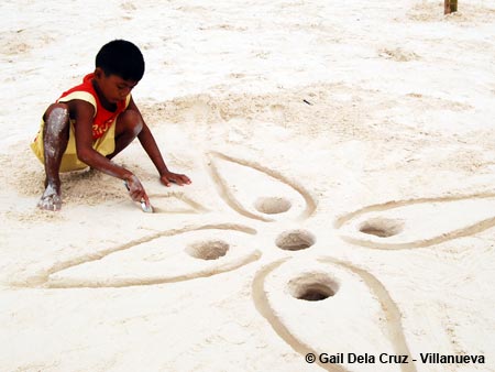 Kid with sand art